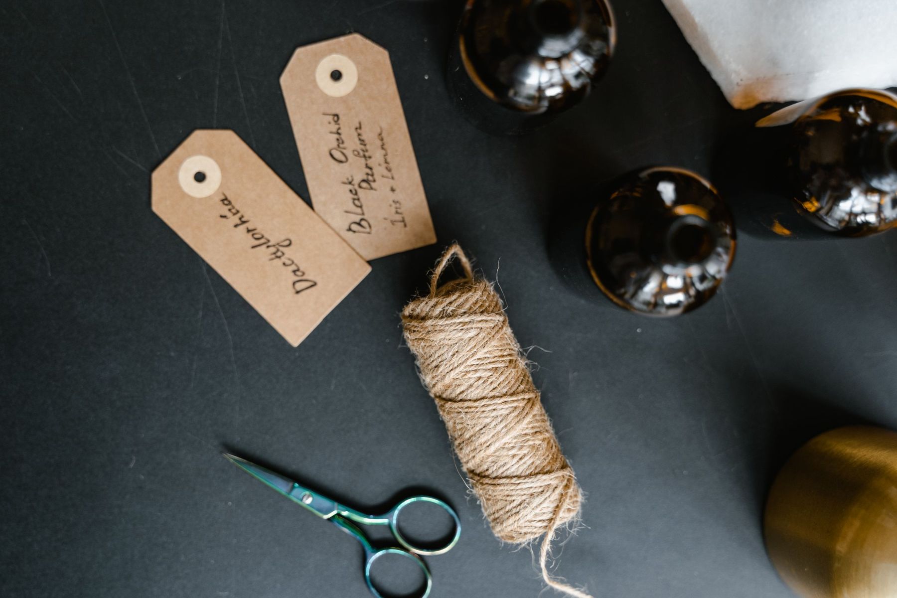 Handwritten fragrance tags and twine